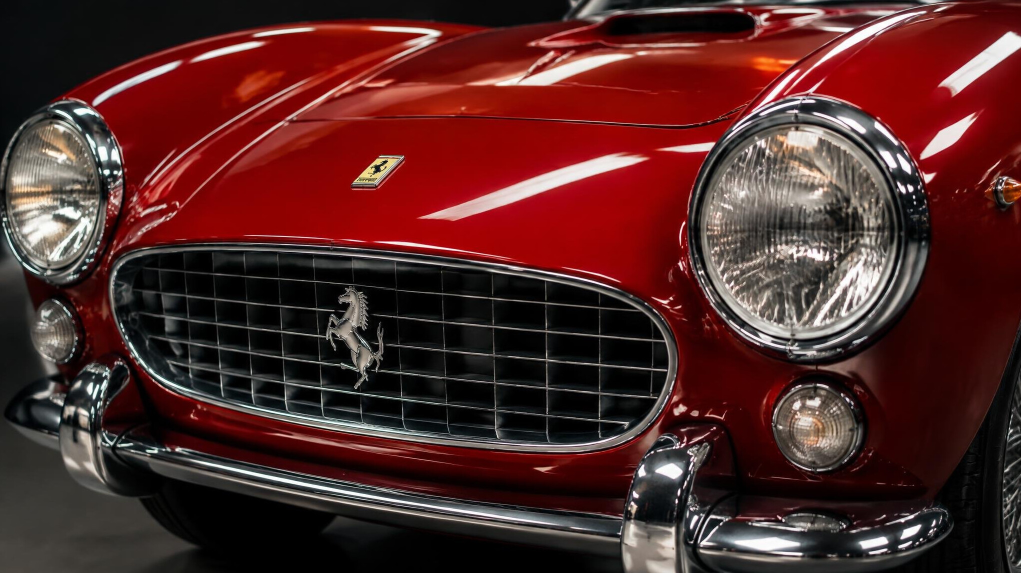 Close-up of the front end and headlights of a classic Ferrari sports car