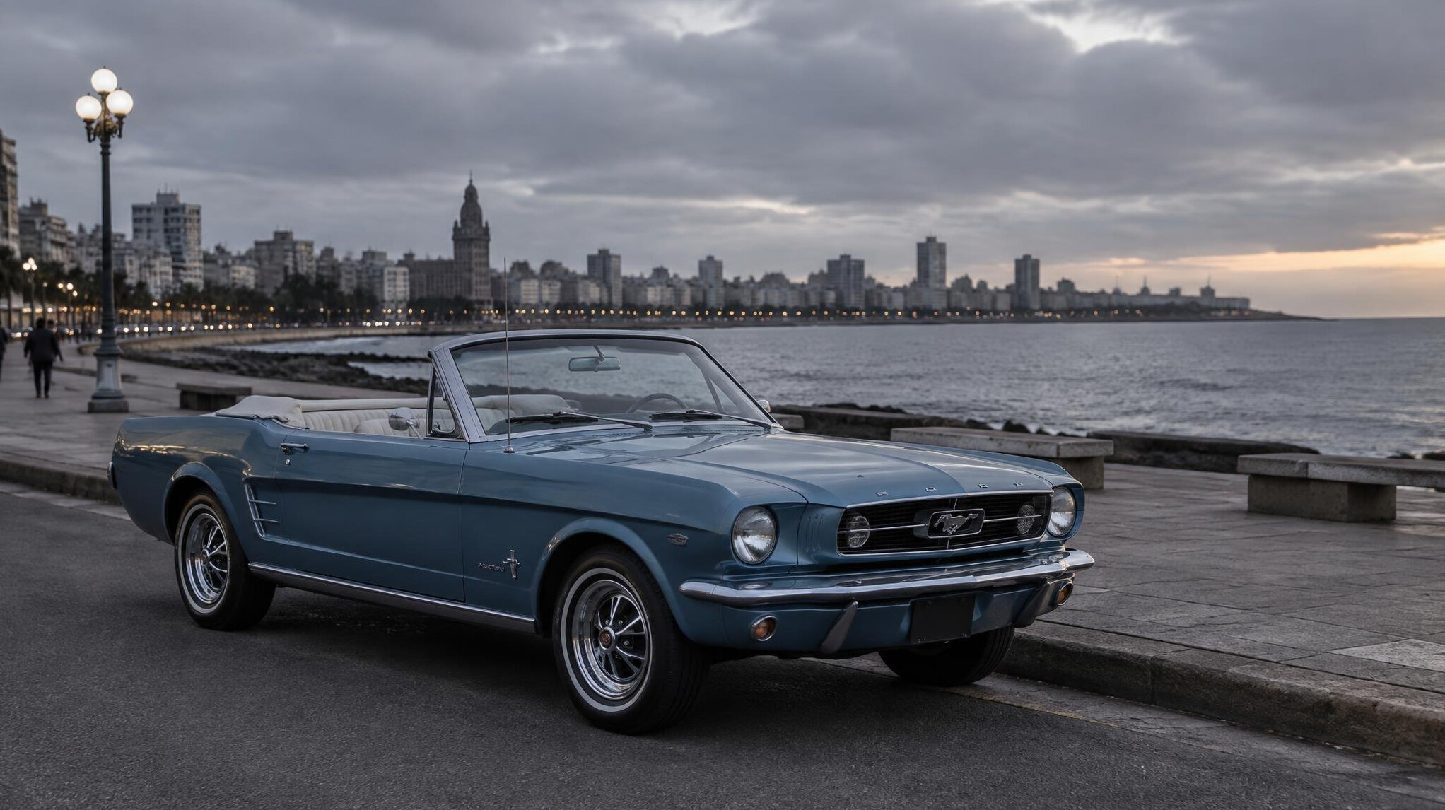Classic convertible car parked along Montevideo's Rambla waterfront promenade